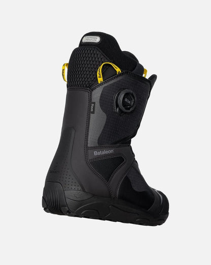 Black Bataleon Rave Double Boa snowboard boot with yellow accents and side Boa dial, shown from a rear three-quarter view.