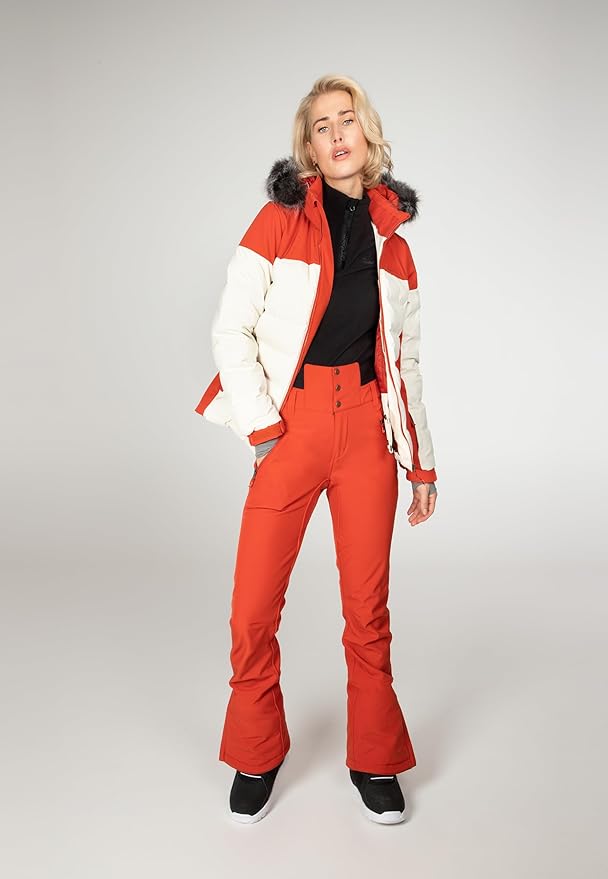 Protest Blackbird women's red and white color-block puffer ski jacket with faux fur hood and matching red pants.