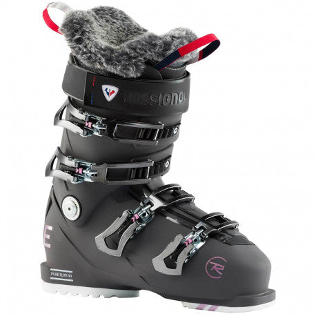 Graphite Rossignol Pure Elite 90 GW women's ski boot with four buckles and a grey faux-fur liner, angled view.